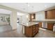 Kitchen with island, granite countertops, and stainless steel appliances at 6713 Guidestar St, North Las Vegas, NV 89084