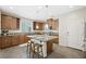 Open kitchen featuring an island, stainless steel appliances, and ample cabinetry at 6713 Guidestar St, North Las Vegas, NV 89084