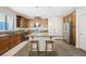 Well-lit kitchen with island, stainless steel appliances, and breakfast bar at 6713 Guidestar St, North Las Vegas, NV 89084