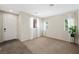 Inviting living room with neutral walls, carpet and tile flooring at 6713 Guidestar St, North Las Vegas, NV 89084