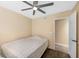 Standard bedroom with tan walls and a ceiling fan with a light at 7026 Westpark Ct, Las Vegas, NV 89147