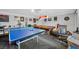 Spacious game room with multiple game tables and ample natural light at 7026 Westpark Ct, Las Vegas, NV 89147