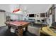 Spacious game room with multiple game tables and ample natural light at 7026 Westpark Ct, Las Vegas, NV 89147