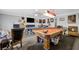 Spacious game room with multiple game tables and ample natural light at 7026 Westpark Ct, Las Vegas, NV 89147