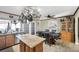 Bright kitchen with stainless steel appliances, wooden cabinets, and a cozy breakfast area at 7026 Westpark Ct, Las Vegas, NV 89147