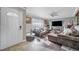 Inviting living room with hardwood floors, a stone fireplace, and an open entryway at 7026 Westpark Ct, Las Vegas, NV 89147
