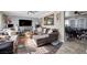 Comfortable living room featuring a fireplace, large television, and a view into a dining area at 7026 Westpark Ct, Las Vegas, NV 89147