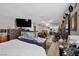 Spacious main bedroom with ample natural light, neutral color palette, and ensuite bathroom at 7026 Westpark Ct, Las Vegas, NV 89147