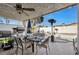 Outdoor patio with a dining table set, BBQ, and pool at 7026 Westpark Ct, Las Vegas, NV 89147