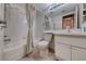 Bright bathroom featuring a shower-tub combination with tiled walls at 7212 Nordic Lights Dr, Las Vegas, NV 89119