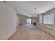 A spacious living room featuring fireplace, and windows with blinds, and neutral color palette at 7212 Nordic Lights Dr, Las Vegas, NV 89119