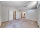 Bright main bedroom features a ceiling fan, neutral walls, and adjoins the en-suite bathroom at 7212 Nordic Lights Dr, Las Vegas, NV 89119