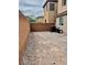 Spacious backyard with tall brick fence, offering a blank canvas for personalization at 7513 Brisa Del Mar Ave, Las Vegas, NV 89179