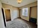A neutral bedroom with a window, closet, and carpeting, offering a cozy atmosphere at 7513 Brisa Del Mar Ave, Las Vegas, NV 89179