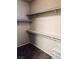 A walk in closet with multiple shelving units for optimal storage and organization at 7513 Brisa Del Mar Ave, Las Vegas, NV 89179