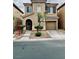 Charming two-story home featuring a well-maintained yard and a one-car garage at 7513 Brisa Del Mar Ave, Las Vegas, NV 89179