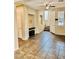 Open living room with tile flooring, ceiling fan and staircase at 7513 Brisa Del Mar Ave, Las Vegas, NV 89179