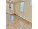 Spacious living room featuring tile floors and natural light from windows at 7513 Brisa Del Mar Ave, Las Vegas, NV 89179