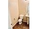 Cozy powder room with pedestal sink, tile floor, and toilet at 7513 Brisa Del Mar Ave, Las Vegas, NV 89179