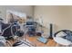 Bright home office with dual monitors, exercise equipment, and natural light at 7517 Elk Meadows Ct, Las Vegas, NV 89131