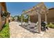 Inviting backyard featuring a pergola and seating area, perfect for entertaining near the refreshing pool at 7914 Elk Mountain St, Las Vegas, NV 89113