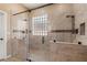 Large walk-in shower showcases dual shower heads, mosaic tile accents, and a glass enclosure at 7914 Elk Mountain St, Las Vegas, NV 89113