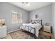 Cozy bedroom offers neutral walls, a window providing natural light, and a comfortable bed at 7914 Elk Mountain St, Las Vegas, NV 89113