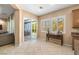 Bright breakfast nook with sliding glass doors, plantation shutters, and an adjacent living area at 7914 Elk Mountain St, Las Vegas, NV 89113