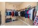 Walk-in closet features custom shelving, ample storage, and organization solutions for clothes and accessories at 7914 Elk Mountain St, Las Vegas, NV 89113