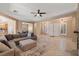 Open-concept living space with tile floors, neutral walls, fireplace, and views into the kitchen and dining areas at 7914 Elk Mountain St, Las Vegas, NV 89113