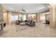 Inviting living room with a stone fireplace, neutral paint, tile floors, and an open floorplan at 7914 Elk Mountain St, Las Vegas, NV 89113