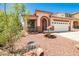 Attractive home with a drought resistant front yard, mature tree, and dolphin fountain at 7929 Palace Monaco Ave, Las Vegas, NV 89117