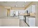 Bright kitchen with stainless steel appliances, granite countertops, and white cabinets at 7929 Palace Monaco Ave, Las Vegas, NV 89117