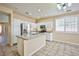 A spacious kitchen featuring an island, stainless appliances, and bright white cabinets at 7929 Palace Monaco Ave, Las Vegas, NV 89117