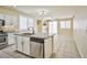 Kitchen island with granite countertops and stainless steel dishwasher with access to the living space at 7929 Palace Monaco Ave, Las Vegas, NV 89117