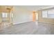 Spacious living area with tiled foyer and plank flooring leading to the home's entrance at 7929 Palace Monaco Ave, Las Vegas, NV 89117
