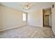 Spacious main bedroom features tile flooring, a ceiling fan, and access to the hallway at 7929 Palace Monaco Ave, Las Vegas, NV 89117