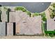 Aerial view showcases the roof and landscaping of the house, featuring a well-maintained lawn and patio at 8574 Verde Park Cir, Las Vegas, NV 89129