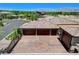 Aerial view of the house highlighting the landscaping, pool, and mountain views at 8574 Verde Park Cir, Las Vegas, NV 89129