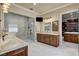 Lavish bathroom with a spacious shower, dual vanities, and elegant fixtures at 8574 Verde Park Cir, Las Vegas, NV 89129
