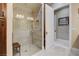 Modern shower with glass enclosure, tiled walls, and a built-in bench at 8574 Verde Park Cir, Las Vegas, NV 89129