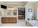 Luxurious bathroom with walk-in closet, featuring a soaking tub and dual vanities at 8574 Verde Park Cir, Las Vegas, NV 89129
