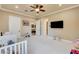 Spacious bedroom featuring neutral walls, carpet, and access to the living area at 8574 Verde Park Cir, Las Vegas, NV 89129