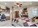 Primary bedroom featuring a four-post bed, carpet, and a built-in desk at 8574 Verde Park Cir, Las Vegas, NV 89129