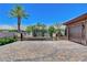 Gated home with long driveway and lush landscaping at 8574 Verde Park Cir, Las Vegas, NV 89129