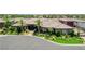 Beautiful single-story home with a tile roof, lush landscaping, and circular driveway at 8574 Verde Park Cir, Las Vegas, NV 89129