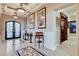 Elegant foyer with marble flooring, decorative accents, and views into other rooms at 8574 Verde Park Cir, Las Vegas, NV 89129