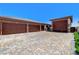 Wide shot of the 4-car garage with an expansive motor court at 8574 Verde Park Cir, Las Vegas, NV 89129