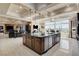 Gourmet kitchen featuring a large island, stainless-steel appliances, and an open layout at 8574 Verde Park Cir, Las Vegas, NV 89129