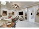 Comfortable living room featuring custom built-in shelving and plenty of seating at 8574 Verde Park Cir, Las Vegas, NV 89129